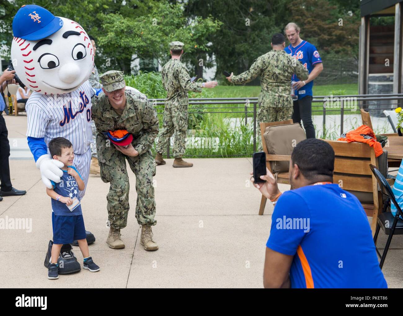 Active duty personnel and their families posed for photos with the New York  Mets mascot, Mr. Met, during a meet and greet event at the United Service  Organizations Warrior and Family Center