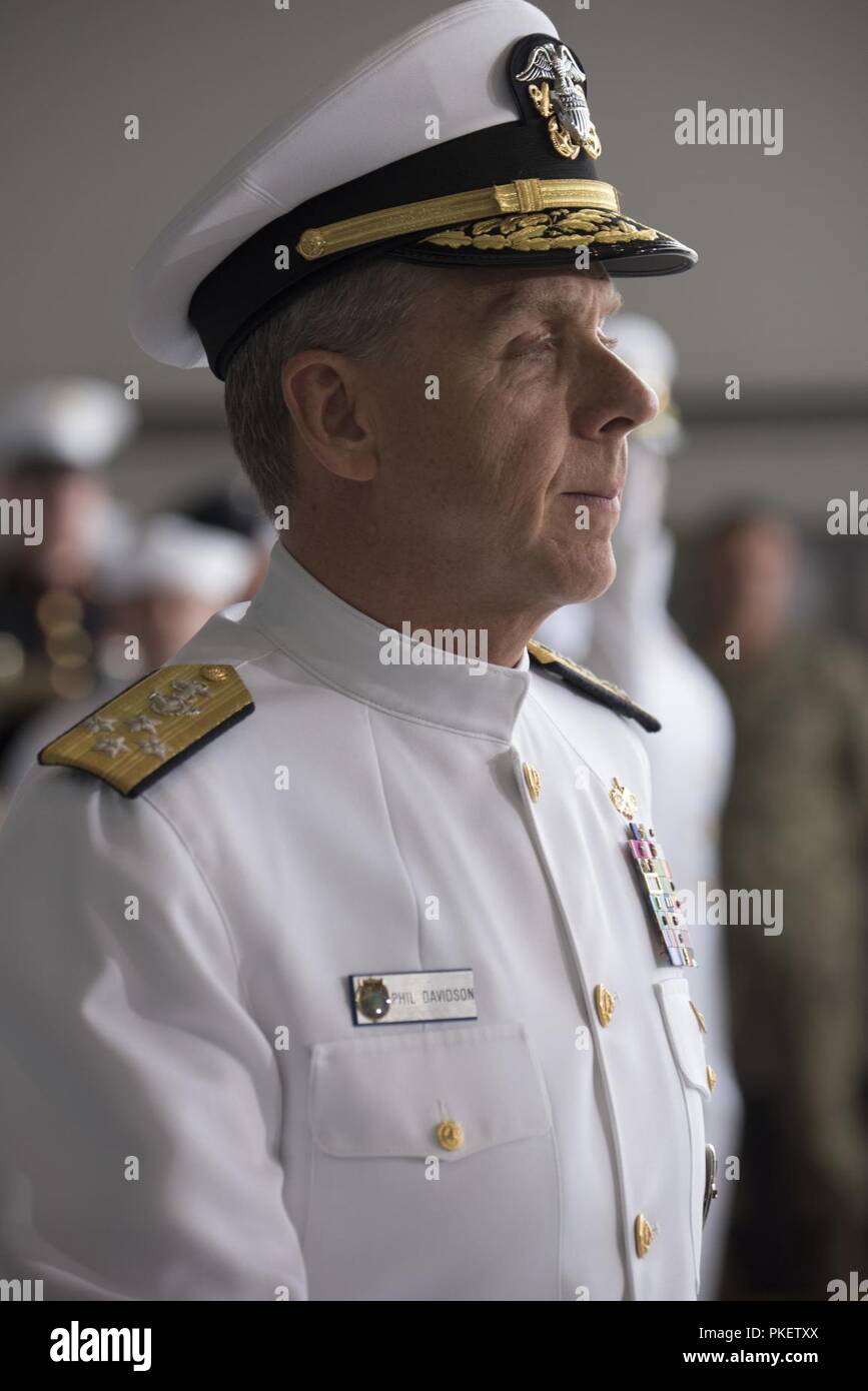 U.S. Navy Adm. Phil Davidson, U.S. Indo-Pacific Command commander, prepares to give remarks at an honorable carry ceremony at Joint Base Pearl Harbor-Hickam, Hawaii, Aug. 1, 2018. The ceremony marked the arrival of 55 transfer cases recently repatriated from North Korea. The Defense POW/MIA Accounting Agency will receive the remains to start the identification process. Stock Photo