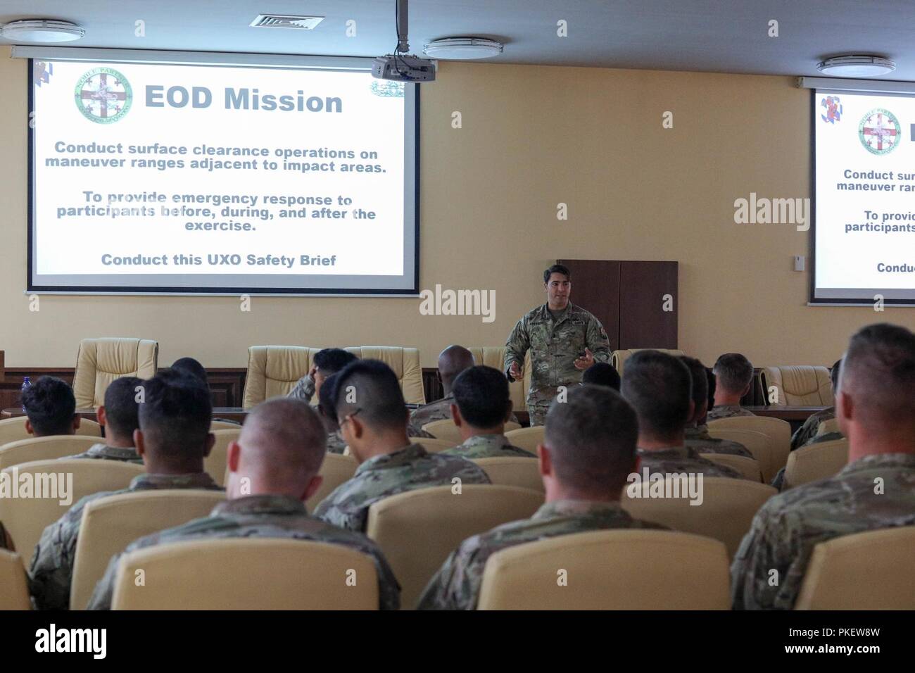 1st Lt. Jorge Acevedo, 702nd Ordnance Company (EOD), provides Soldiers from Cobra Battery, Field Artillery Squadron, 2d Cavalry Regiment unexploded ordnance training in preparation for their upcomming live fire exercises at the Vaziani Training Area, Georgia, July 31, 2018. Cobra Battery is providing fires support to the 3rd Squadron, 2CR for Noble Partner 18 - a Georgian Armed Forces and U.S. Army Europe cooperatively-led exercise in its fourth iteration. The exercise is intended to support and enhance the readiness and interoperability of Georgia, the U.S. and participating nations during a  Stock Photo