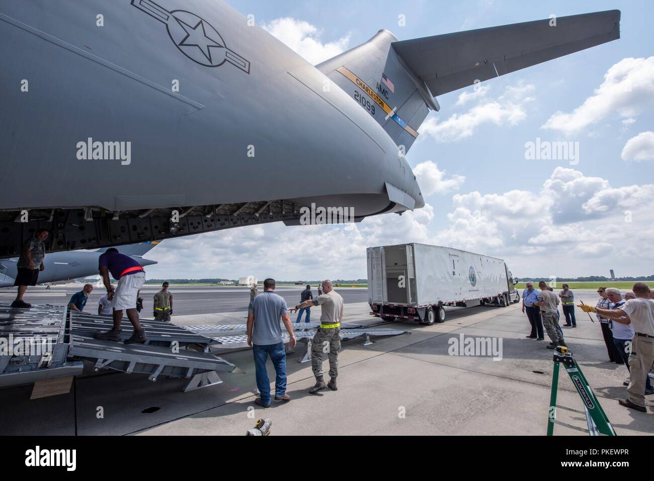 Charleston, S.C. (26 July, 2018) Members of the 437th Aerial Port Squadron and Space and Naval Warfare Systems Center (SSC) Atlantic engineers conduct a test load of a Large Mobile Air Traffic Control Tower (LMATCT) onto a C-17 Globemaster III July 26 at the Joint Base Charleston - Air Base. The test load was conducted in order to validate the Air Transportability Test Loading Activity certification and ensure the newly constructed towers were compatible for airlift aboard U.S. Air Force aircraft. The new models, specifically designed to be transportable on military airlift, directly support t Stock Photo