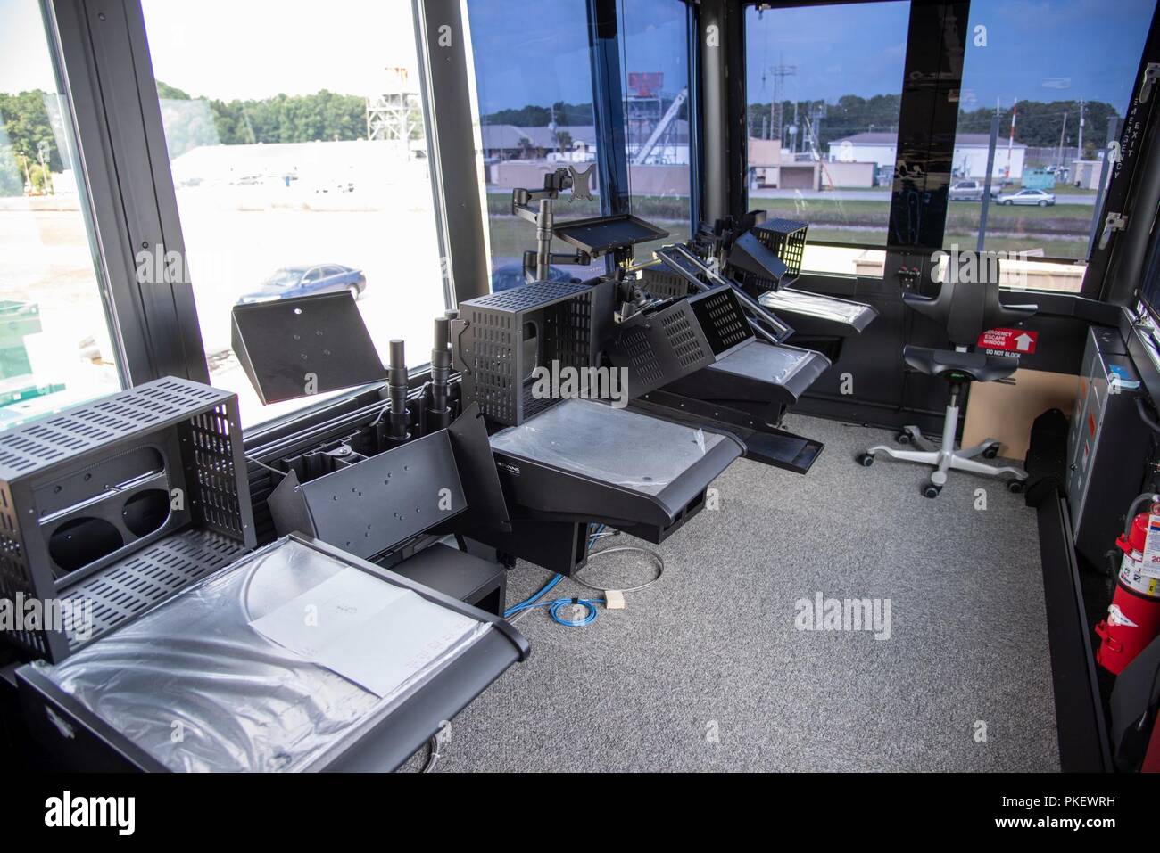 Charleston, S.C. (26 July, 2018) The inside of a newly constructed Large Mobile Air Traffic Control Tower (LMATCT) is displayed at the Joint Base Charleston - Weapons Station during an inspection with members from Space and Naval Warfare Systems Center (SSC) Atlantic and the Federal Aviation Administration. SSC Atlantic worked with the FAA to provide the integration and engineering support for upgrading the LMATCTs due to their extensive background in deployable control centers. The FAA is scheduled to roll out three LMATCT platforms by Fiscal Year 2019, replacing older models originally const Stock Photo
