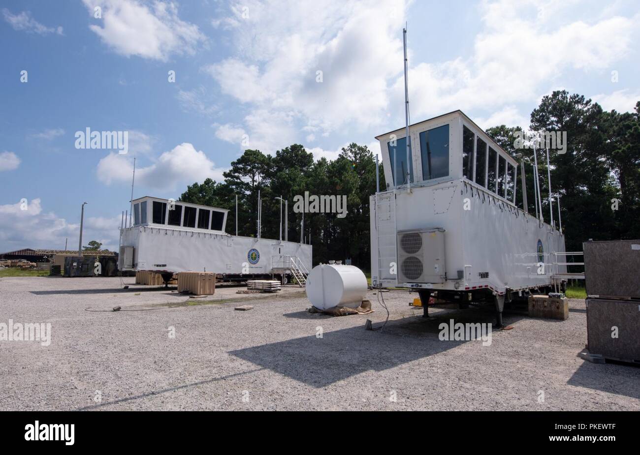 Charleston, S.C. (26 July, 2018) Newly designed Large Mobile Air Traffic Control Towers (LMATCT) are staged at the Joint Base Charleston - Weapons Station in preparation for final inspections and electronics testing by Space and Naval Warfare Systems Center (SSC) Atlantic engineers and Federal Aviation Administration officials. Members from SSC Atlantic were asked by the FAA to provide the integration and engineering support for upgrading the LMATCTs due to their extensive background in deployable control centers. Stock Photo