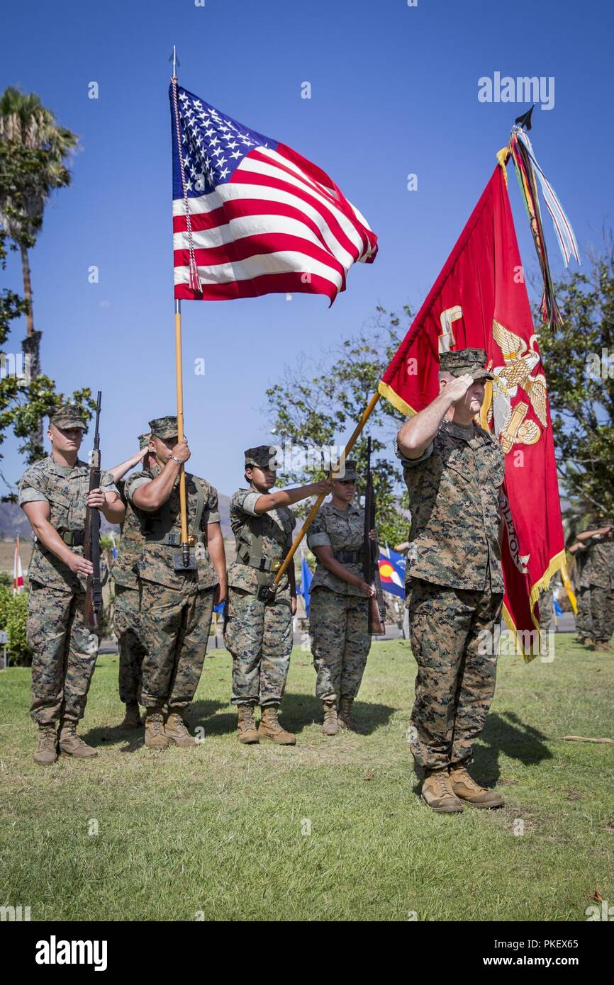 U.S. Marine Corps Col. Ian R. Clark, commanding officer, Marine Corps Air Station Camp Pendleton (MCAS) outgoing, salutes during the playing of the national anthem at the Santa Margarita Ranch House, Marine Corps Base Camp Pendleton, California, August 2, 2018. Clark relinquished command of MCAS Camp Pendleton to Col. Richard T. Anderson, incoming commanding officer, MCAS Camp Pendleton. Clark served as the commanding officer for MCAS Camp Pendleton for three years. Stock Photo