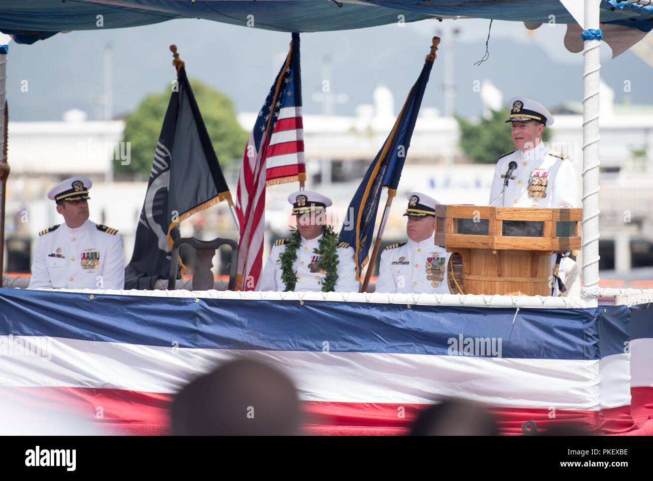 PEARL HARBOR (August 2, 2018) - Rear Adm. Stuart B. Munsch, Assistant Deputy Chief of Naval Operations for Operations, Plans and Strategy  delivers remarks during a change of command ceremony for USS Hawaii (SSN 776) on the submarine piers in Joint Base Pearl Harbor-Hickam, August 2. Cmdr. Sterling S. Jordan relieved Cmdr. John C. Roussakies as Hawaii’s commanding officer. Stock Photo