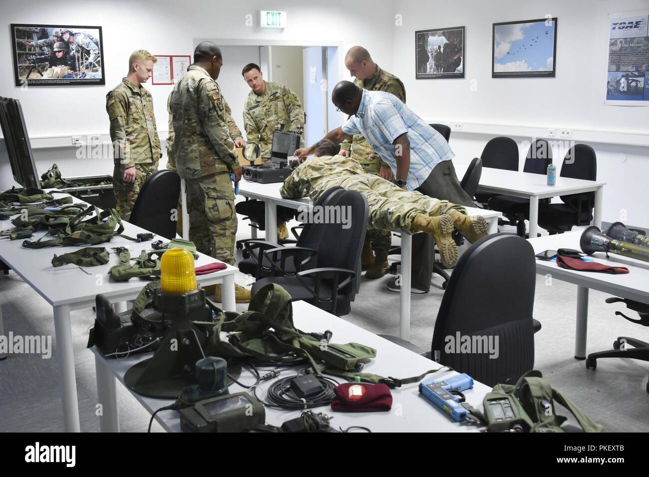 Sunday Omikorede, right, a Training Aids and Devices warehouse manager