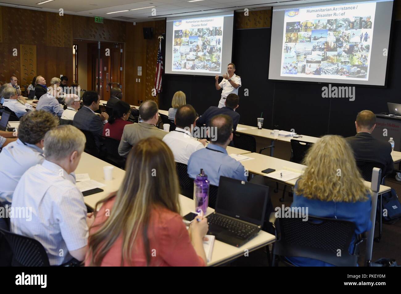 PITTSBURGH, Pa. (Aug. 2, 2018) Rear Adm. David Hahn, chief of naval research, talks at the Artificial Intelligence (AI) & Autonomy for Humanitarian Assistance and Disaster Relief (HADR) workshop, co-hosted by the Office of Naval Research and Carnegie Mellon University, about AI and the Department of the Navy. The workshop brings together a community of academia, industry, and government stakeholders with a diverse pool of first responders in order to accelerate the experimentation, fielding, and scaling of new AI and autonomous capabilities in support of the HADR mission. Stock Photo