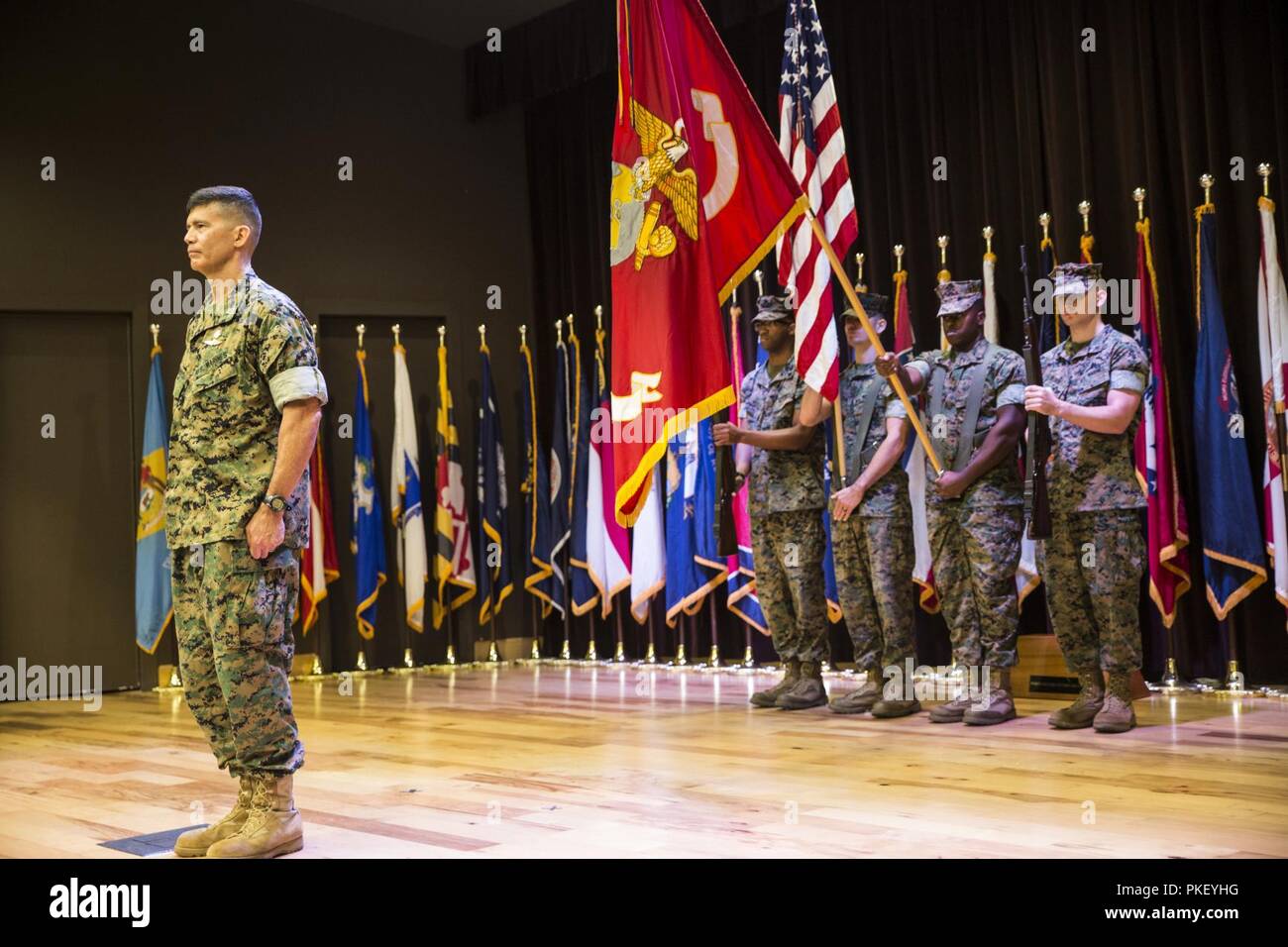 Brig. Gen. Mark Hashimoto, commander of Force Headquarters Group, stands at attention as the colors are presented in honor of Hashimoto taking command of FHG at the Federal City Auditorium, New Orleans, Aug. 3, 2018. Hashimoto relieved Maj. Gen. Michael F. Fahey, who served as the commander of FHG from 2016-2018. Stock Photo