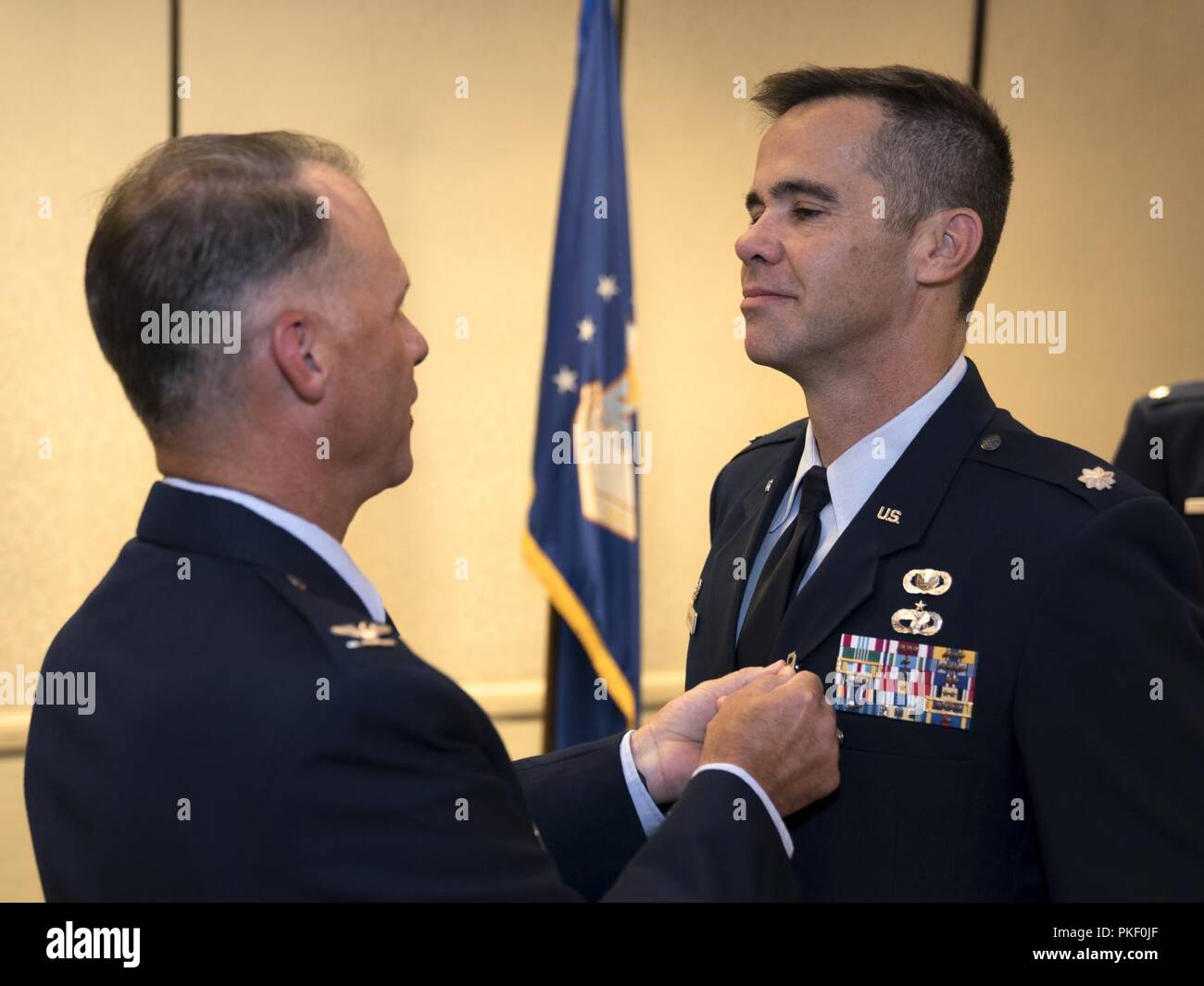 Col. Stephen Lanier, 315th Operations Group commander, presents a Meritorious Service Medal to Lt. Col. Hamilton Underwood, 4th Combat Camera Squadron commander, during a change of command ceremony Aug. 3, 2018, at Joint Base Charleston, S.C. The 4th CTCS is the only Reserve combat camera unit and is a rapid response force, specializing in aerial documentation. Underwood served as the 4th CTCS commander from 2014 to 2015, and again from 2017 to 2018 after the unit reactivated. Stock Photo