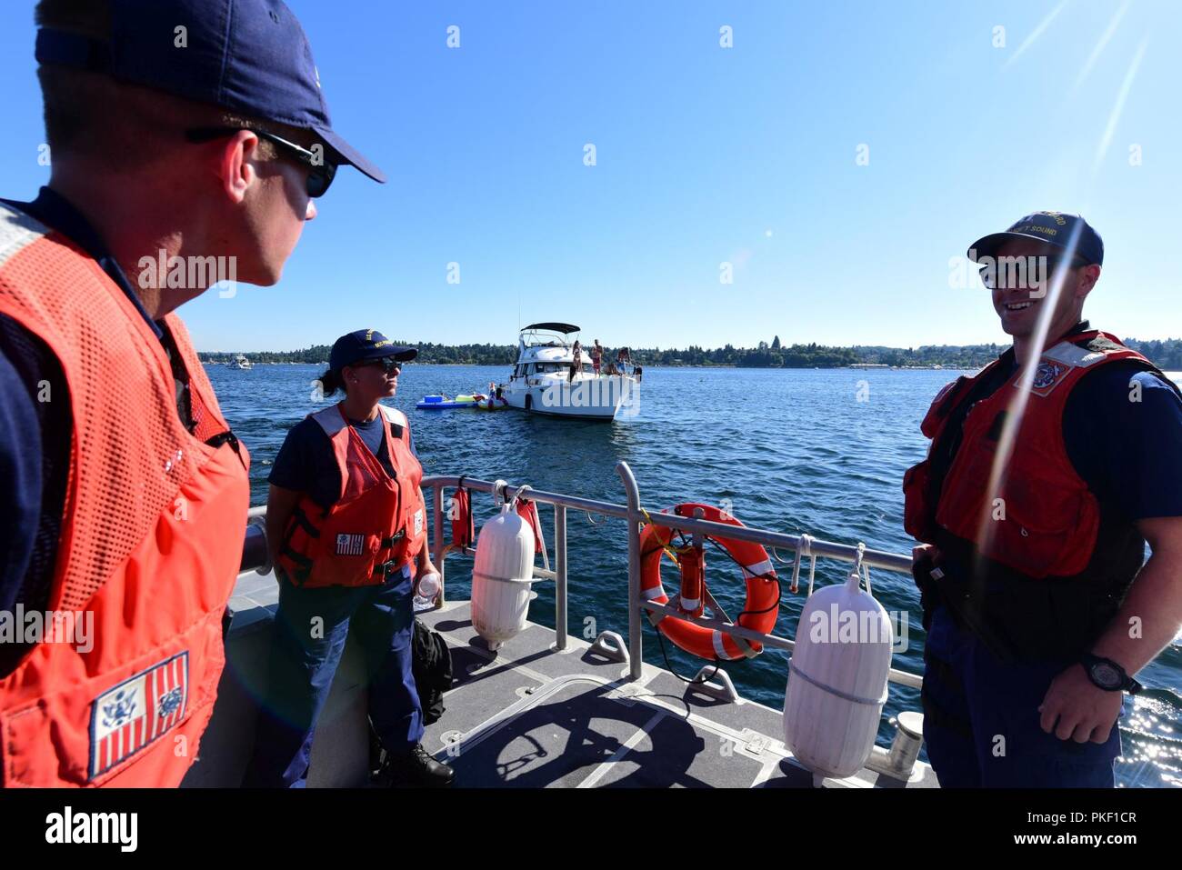 Coast Guard Cmdr. JoAnn Burdian (center), the Chief of Response at