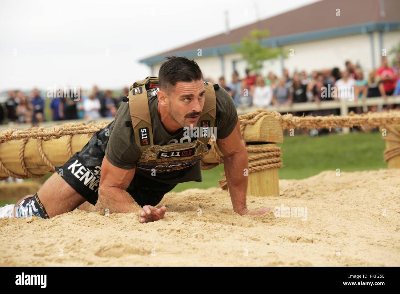 CrossFit athlete Craig Kenney negotiates the obstacles on the  "Battleground" during the 2018 Reebok CrossFit Games in Madison, Wisconsin,  August 3, 2018. The CrossFit Games is the world's premiere test to find