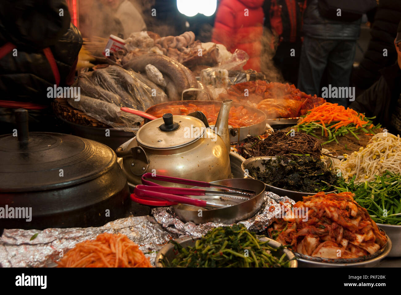 Traditional Korean food market with fresh kimchi, vegetables and meat