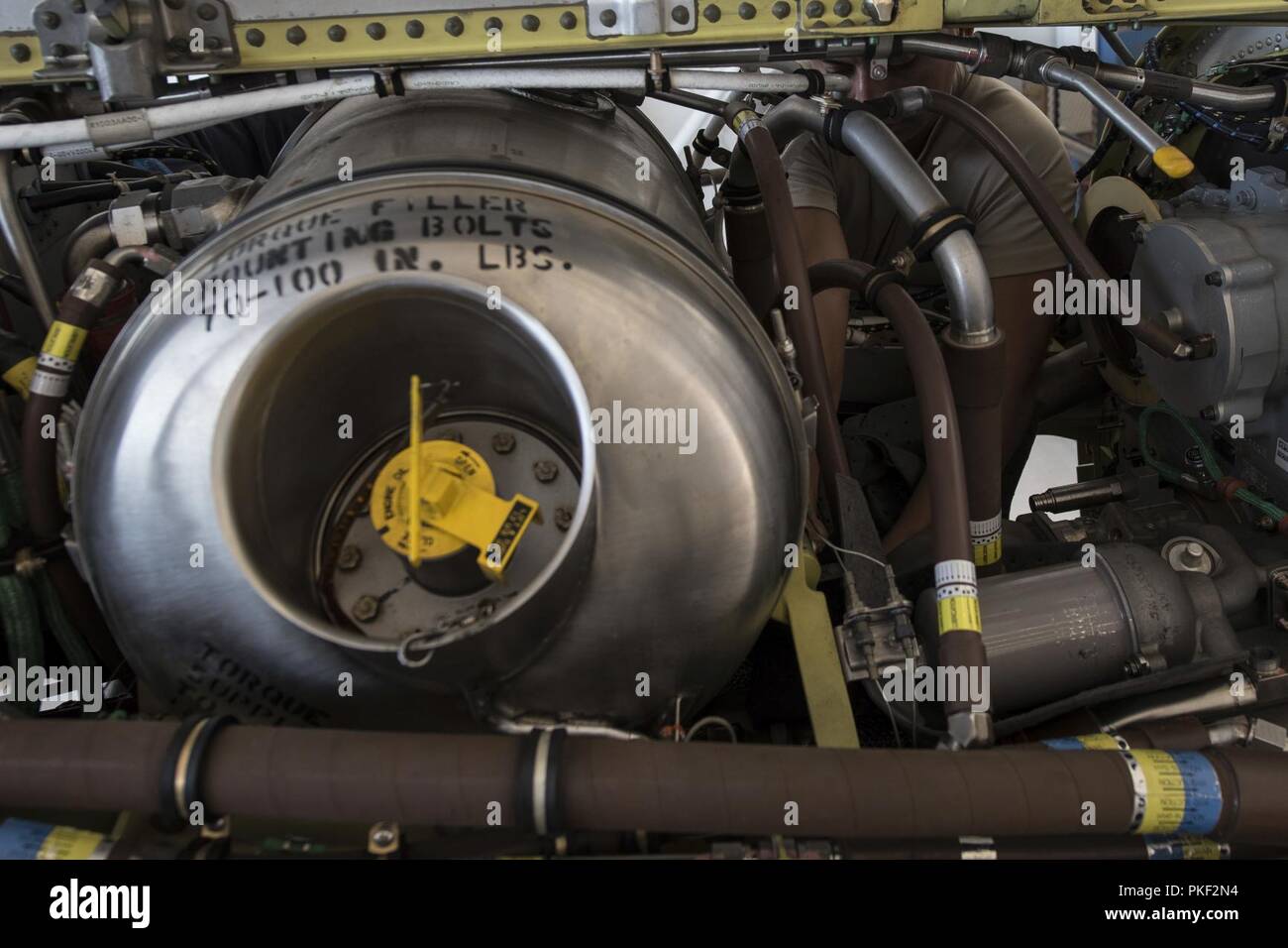 Airman 1st Class Peter Murphy, 27th Special Operations Aircraft Maintenance Squadron journeyman, works on the engine of a MC-130J Commando II at Cannon Air Force Base, N.M., Aug. 1, 2018. The aircraft had recently returned from extensive use and required in-depth maintenance. Stock Photo