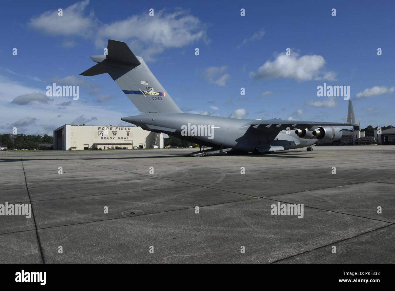 145th Airlift Wing C-17 Globemaster III Aircraft 0183 sits for the first time on the flight line of Pope Army Airfield, during the first NCANG C-17 mission to Pope Army Airfield, while at Pope Army Airfield, Fayetteville North Carolina, August 1, 2018. The mission to Pope Field is the first of what is hoped to be many, by October the 145th Airlift Wing plans to begin supporting Airdrop missions with weekly flights to Pope Field, picking up Soldiers and Cargo for regular Airborne operations. Stock Photo