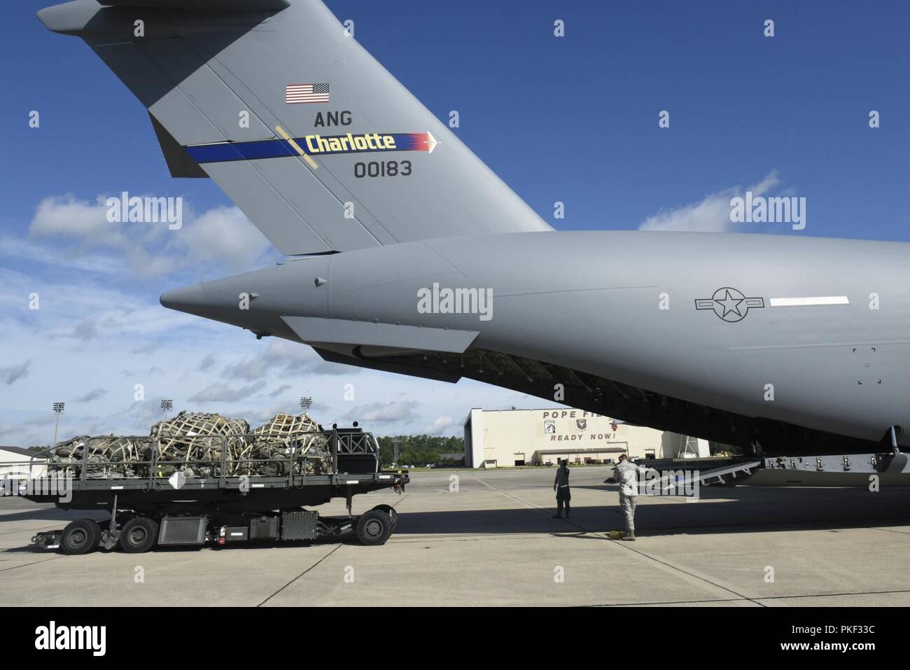 Three pallets of Army luggage is loaded aboard a North Carolina Air National Guard (NCANG) C-17 Globemaster III Aircraft as part of the very first C-17 mission for the NCANG to Pope Army Airfield, while at Pope Army Airfield, Fayetteville North Carolina, August 1, 2018. The mission to Pope Field is the first of what is hoped to be many, by October the 145th Airlift Wing plans to begin supporting Airdrop missions with weekly flights to Pope Field, picking up Soldiers and Cargo for regular Airborne operations. Stock Photo