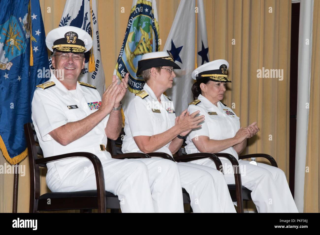 Rear Admiral Tina Davidson, Nurse Corps, U.S.Navy, assumes command of the Navy Medicine Education, Training and Logistics Command from Rear Admiral Rebecca McCormick-Boyle at Joint Base San Antonio-Fort Sam Houston, Texas, Aug. 3, 2018. Vice Admiral C. Forrest Faison, III, surgeon general of the Navy, officiated the time honored ceremony. Stock Photo