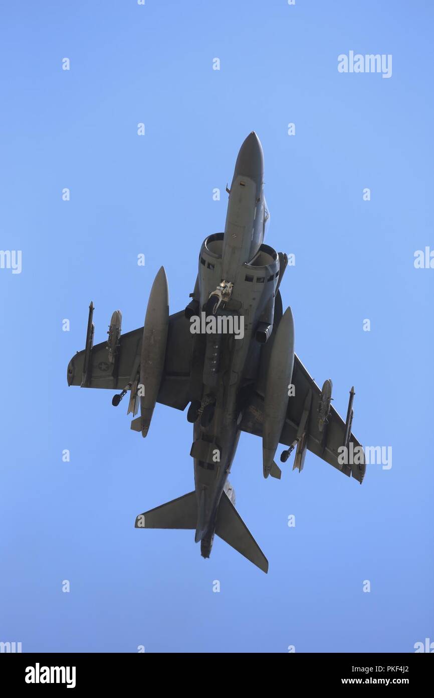 An AV-8B Harrier with Marine Attack Squadron (VMA) 214, Marine Aircraft Group (MAG) 13, 3rd Marine Aircraft Wing, prepares to land at a forward arming and refueling point during Exercise Summer Fury 2018. at Camp Pendleton, Calif., Aug. 1. Summer Fury is designed to increase the functionality and effectiveness of 3rd MAW while also enhancing Marine Air-Ground Task Force and naval integration with participating I Marine Expeditionary Force and naval units. Stock Photo