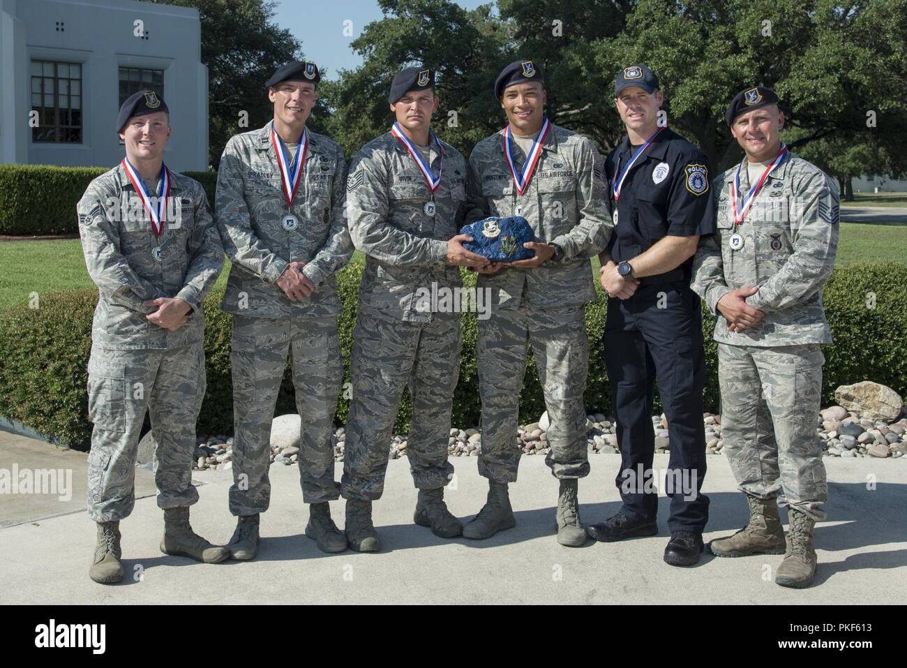(left to right) Senior Airman William McLaughlin, 502nd Security Forces Squadron, Capt. Nathan Spradley, 902nd SFS, Technical Sgt. Cory Irvin, 37th Training Support Squadron, Senior Airman David Hightower, 56th SFS, Officer Jonathan Vance and Master Sgt. James Murray of the 802nd SFS, pose for a photo after being chosen as the representatives of Air Education and Training Command’s Defender Challenge team July 27, 2018, at Joint Base San Antonio-Randolph, Texas. Defender Challenge is a Security Forces competition that pits teams against each other in realistic weapons, dismounted operations an Stock Photo
