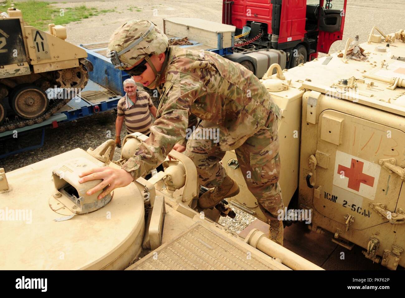 U.S. Army Pvt. Patrick Creeden assigned to 2nd Battalion, 5th Cavalry Regiment, 1st Armored Brigade Combat Team, 1st Cavalry Division prepares a M113 Armored Personnel Carrier for mission at Vaziani Training Area, Georgia, as part of Noble Partner, July 26, 2018.  Soldiers of Bravo and Charlie Company, 2-5 CAV deployed for the Georgian Armed Forces and U.S. Army Europe event hosted at Vaziani and Camp Norio training areas in Georgia. Stock Photo