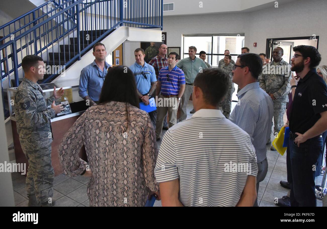 U.S. Air Force Tech. Sgt. Zachary Bartlett, 81st Training Group military training leader, briefs congressional staffers on the Levitow Training Support Facility functions used by the Airmen in the 81st TRG on Keesler Air Force Base, Mississippi, Aug. 6, 2018. The staffers visited Keesler from the offices of Senators Roger Wicker and Cindy Hyde-Smith and Congressman Trent Kelly to receive an overview of the 81st Training Wing to identify areas which could use congressional support. Stock Photo