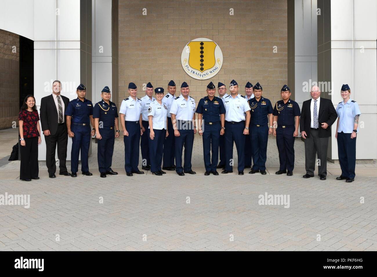 Royal Thai air force leadership pose for a photo with Pacific Air Forces, 17th Training Wing and Air Force Security Assistance Training Squadron leadership outside the Norma Brown building during a tour on Goodfellow Air Force Base, Texas, Aug. 2, 2018. The overall intent for the visit was to share with RTAF partners how the U.S. Air Force organizes, trains and equips its intelligence professionals to achieve mission success. Stock Photo