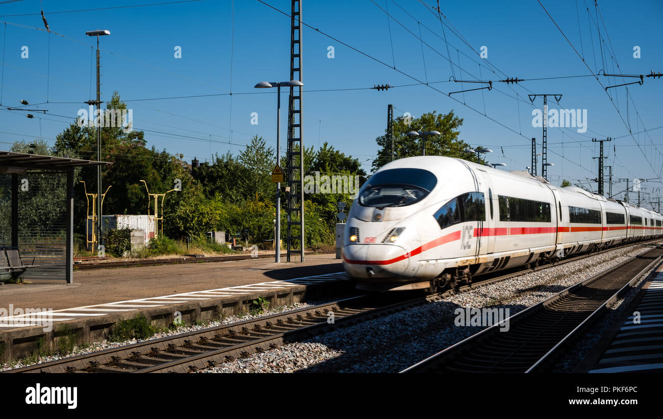Mullheim, Baden-Wurttemberg, Germany - JULY 30 2018 : ICE 3 Intercity-Express high-speed train of the Deutsche Bahn (DB) passing the Mullheim railway  Stock Photo