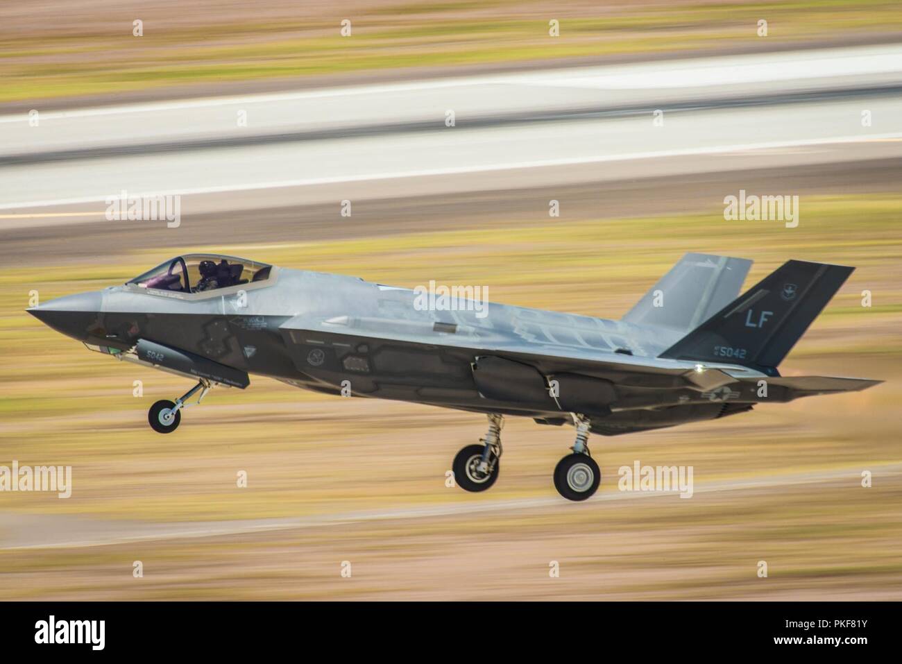 An F-35A Lightning II pilot, assigned to the 56th Fighter Wing, retracts the landing gear after takeoff at Luke Air Force Base, Ariz., Aug. 3, 2018. Currently 72 F-35’s are assigned to Luke AFB flying more than 20,000 hours since first arriving in 2014. Stock Photo