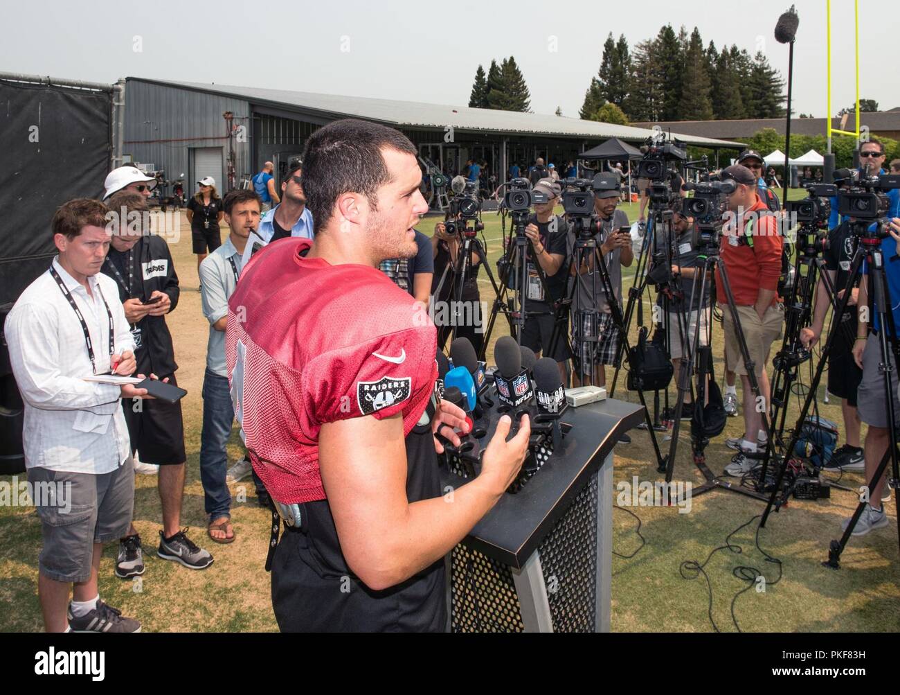 Oakland Raiders Quarterback Derek Carr speaks with the media after his practice in Napa Valley, Calif., August 7, 2018. The Raiders invited Travis Air Force Base Airmen to attend camp and were treated to a scrimmage between the Raiders and Detroit Lions and a meet and greet autograph session with players and coaches from both teams. Stock Photo