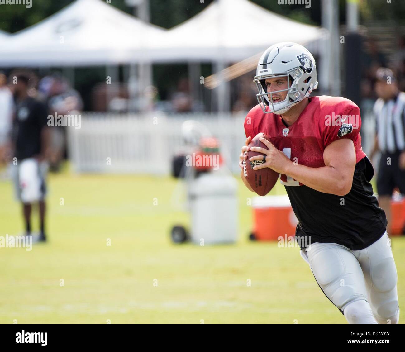 Oakland Raiders Quarterback Derek Carr throws a pass during practice at their training facility in Napa Valley, Calif., August 7, 2018. The Raiders invited Travis Air Force Base Airmen to attend camp and were treated to a scrimmage between the Raiders and Detroit Lions and a meet and greet autograph session with players and coaches from both teams. Stock Photo