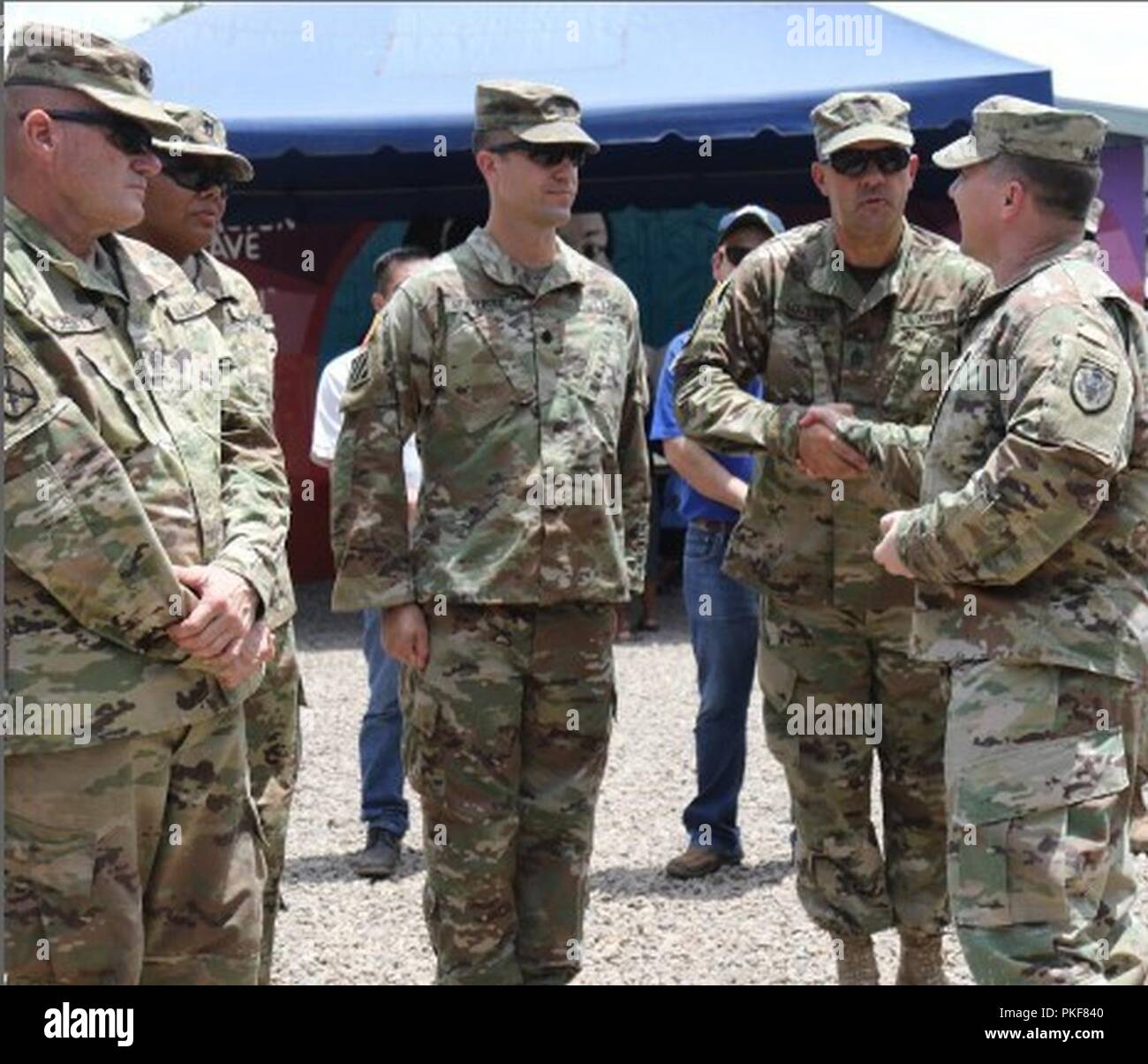 Sgt. Maj. Mallie Lovett, BTH 2018 Task Force Engineer Senior Enlisted Advisor, Florida Army National Guard receives coin at the closing ceremonies for Beyond the Horizon 2018, July 30.     BTH 2018 is a humanitarian training mission between the Government of El Salvador and the U.S. Embassy El Salvador, together with the U.S. Southern command to conduct five medical exercises and five construction projects over a three-month period in El Salvador. (National Guard Stock Photo
