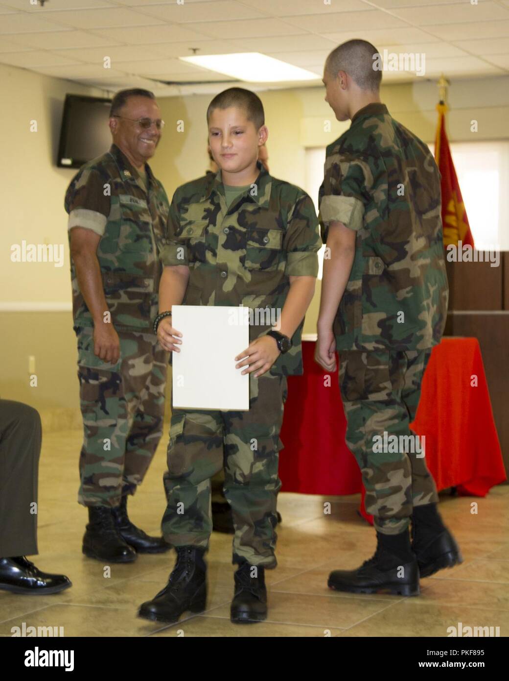 Excelsior Charter School's Young Marines receive awards for various activities in which they participate as part of their graduation ceremony held at the Maj. Gen. James L. Day Conference Center aboard Marine Corps Logistics Base Barstow, Calif., July 28. The Young Marines resided on base and endured a week of training to include tackling the obstacle course, swim training, conditioning hikes and more all in an effort to give them a taste of Marine Corps life. Stock Photo