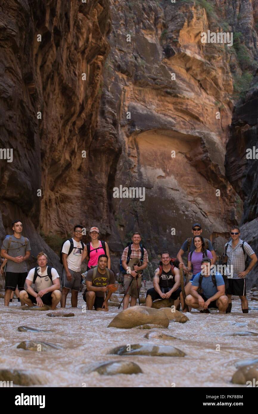 U.S. Marines pose for a group photo during a Single Marine Program (SMP) trip at Zion National Park, Utah, Aug. 4, 2018. The Program Dirrector’s goal is to keep single service members physically, mentally and socially active while living in the barracks. Stock Photo