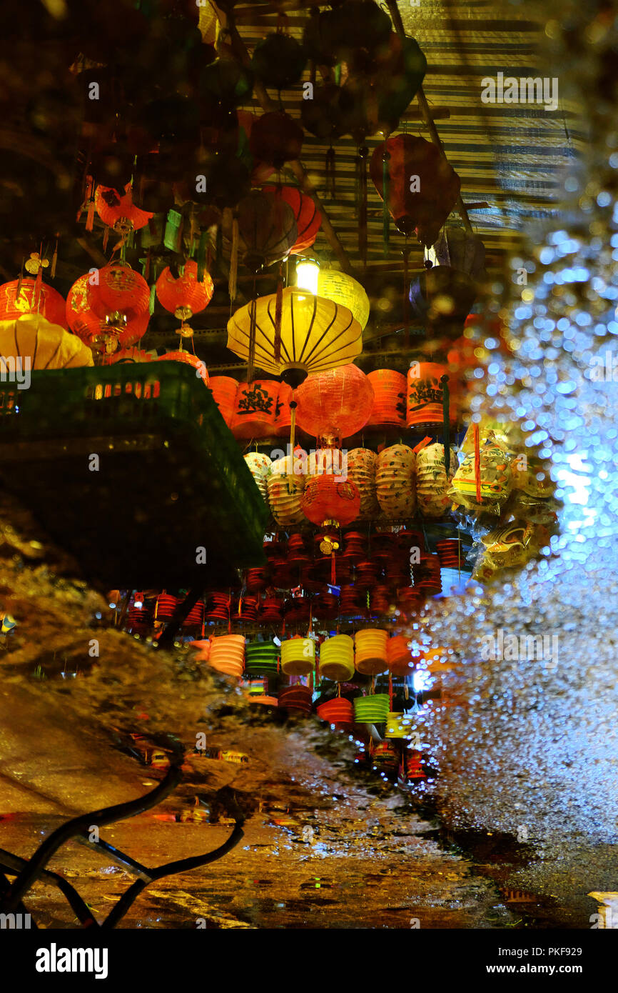 Lanterns reflect on surface water make lantern background with amazing bokeh lights Stock Photo