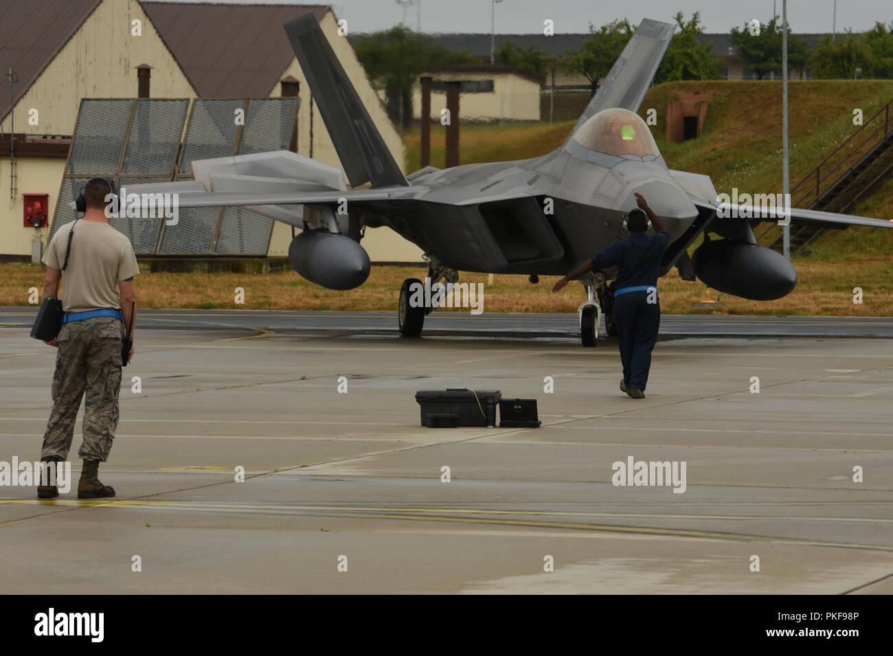 U.S. Air Force F-22 Raptors from the 95th Fighter Squadron, 325th Fighter Wing at Tyndall Air Base, Fla., arrive at Spangdahlem Air Base, Germany, Aug. 8, 2018. The 95th FS is deployed to Europe for several weeks to conduct training with other European-based aircraft as part of a Flying Training Deployment. Forward locations enable collective defense capabilities and provide U.S. and NATO the strategic and operational breadth needed to deter adversaries and assure our allies and partners. Stock Photo