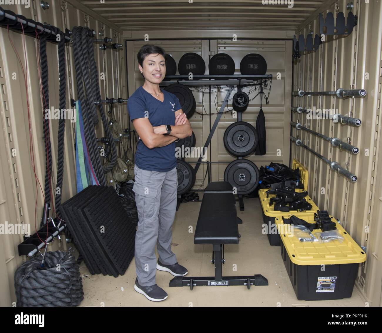 Sabine Lopez, 11th Force Support Squadron fitness and operations manager, poses for a photo in a tactical training locker on Joint Base Andrews, Md., Aug. 2, 2018. The tactical training locker is a container that holds enough equipment to allow 50 people to work out outdoors. Stock Photo