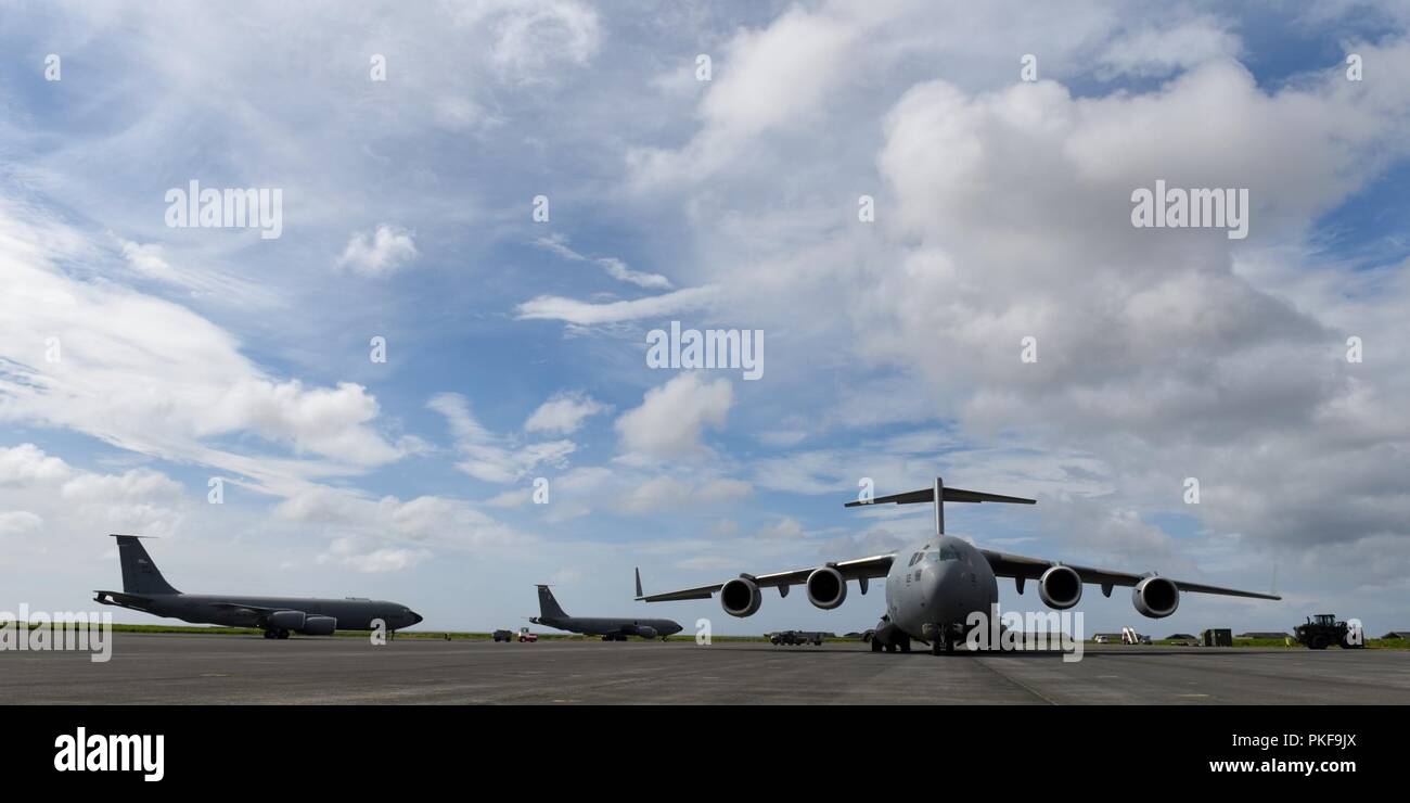 A C-17 Globemaster III from the Heavy Airlift Wing, Pápa Air Base, Hungary, and two KC-135 Stratotankers from the 100th Air Refueling Wing, Royal Air Force Mildenhall, England, sit on the flightline at Keflavik Air Base, Iceland, July 31, 2018, in support of NATO’s Icelandic Air Surveillance mission. The 493rd Expeditionary Fighter Squadron airlifted in all the equipment needed to operate the full-scale IAS mission from the installation. Stock Photo