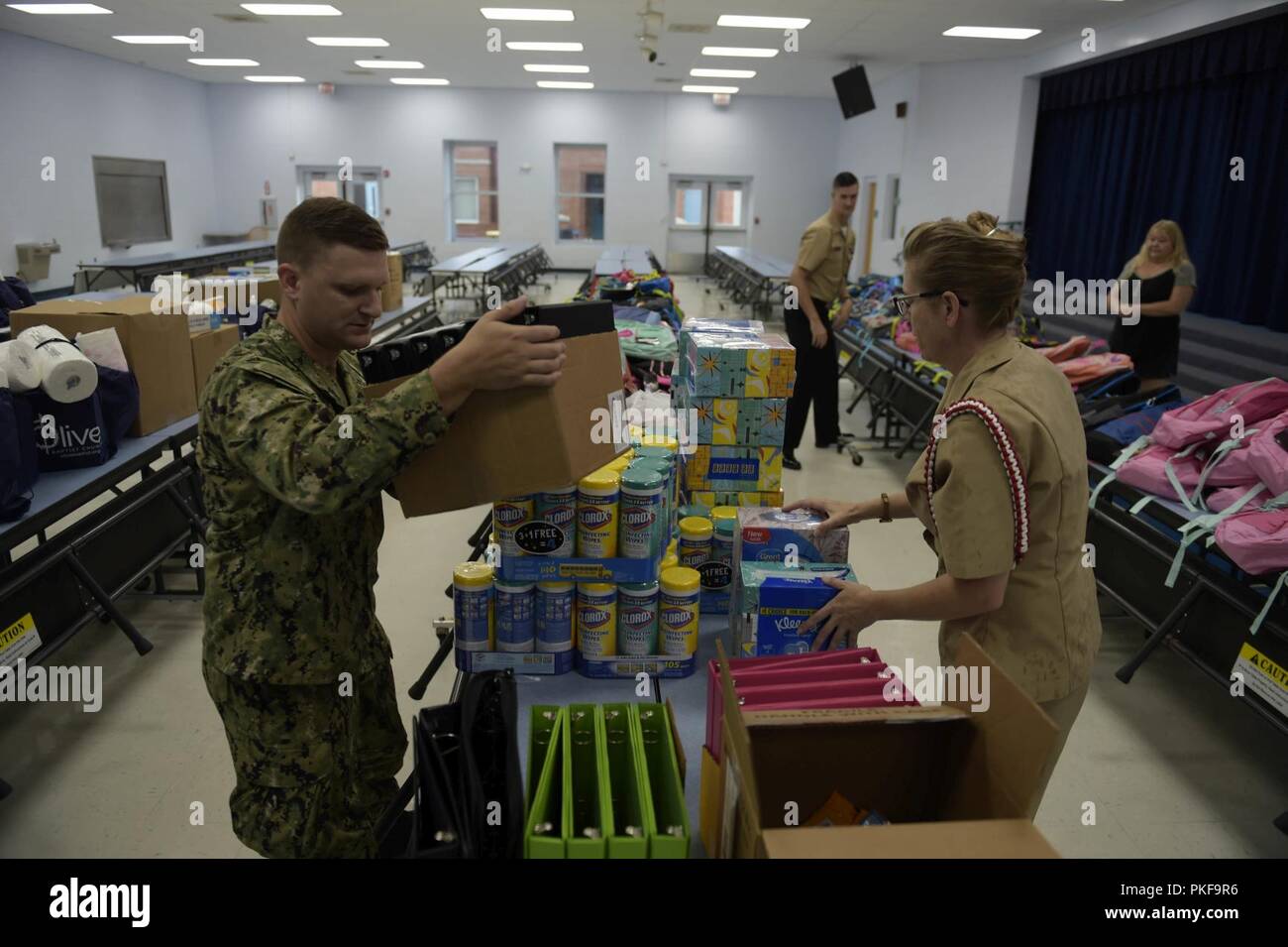 Fla. (Aug. 10, 2018) Sailors from the Center for Information Warfare Training (CIWT) and Information Warfare Training Command (IWTC) Corry Station drop off school supplies collected during a school supply drive for Navy Point Elementary School. The drive was organized by IWTC Corry Station’s First Class Petty Officer Association and collected more than $5,000 in donations from CIWT, IWTC Corry Station and local businesses and veterans associations. Stock Photo