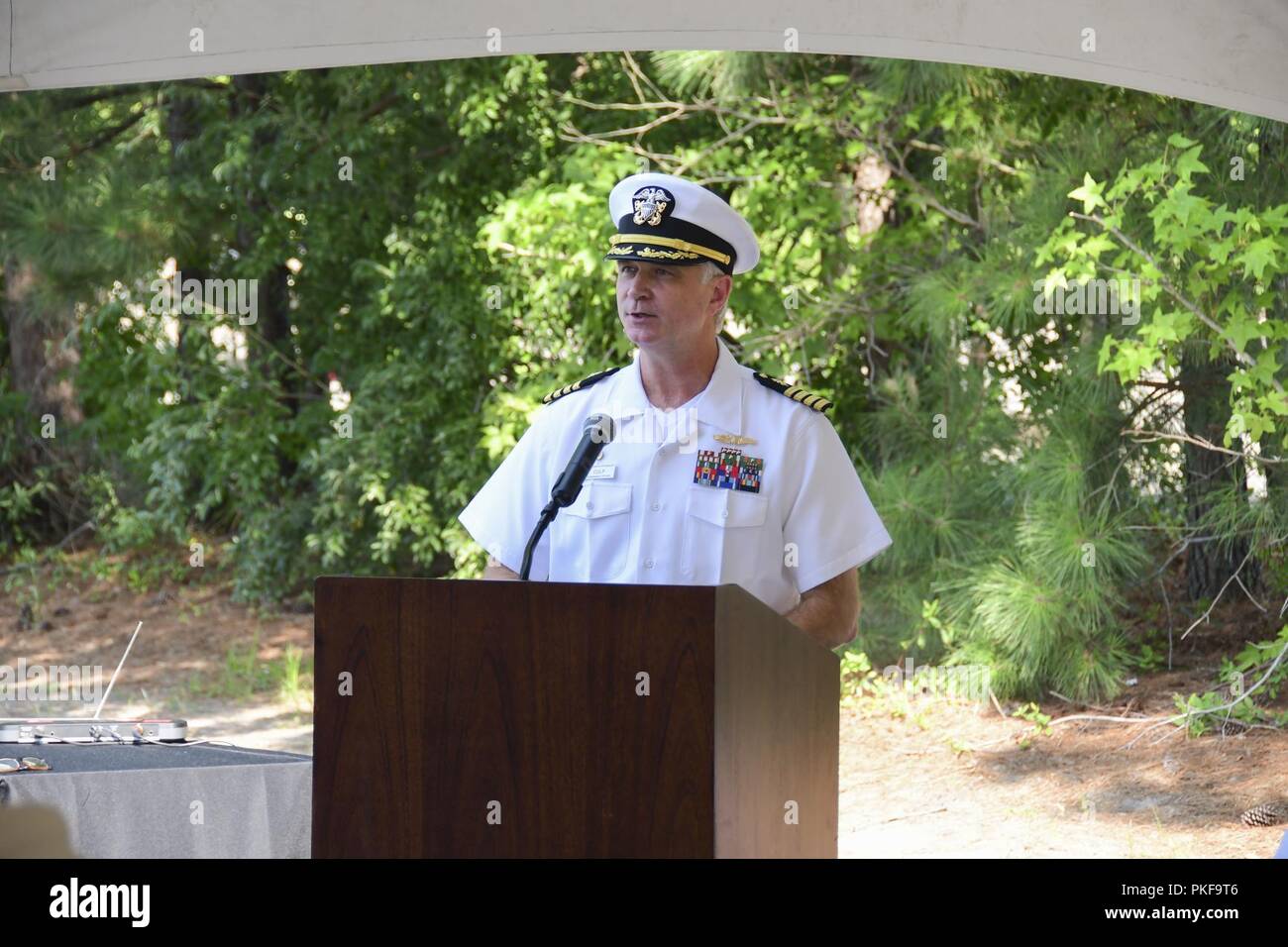 - Capt. Christopher Culp, NMCP commanding officer, speaks at the TRICARE Prime Clinic Chesapeake's new location Ribbon Cutting Ceremony, Aug. 10. Stock Photo