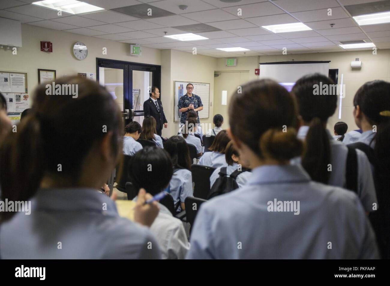 Lt. Bethany D. Brooks, centerright, gives a presentation to students