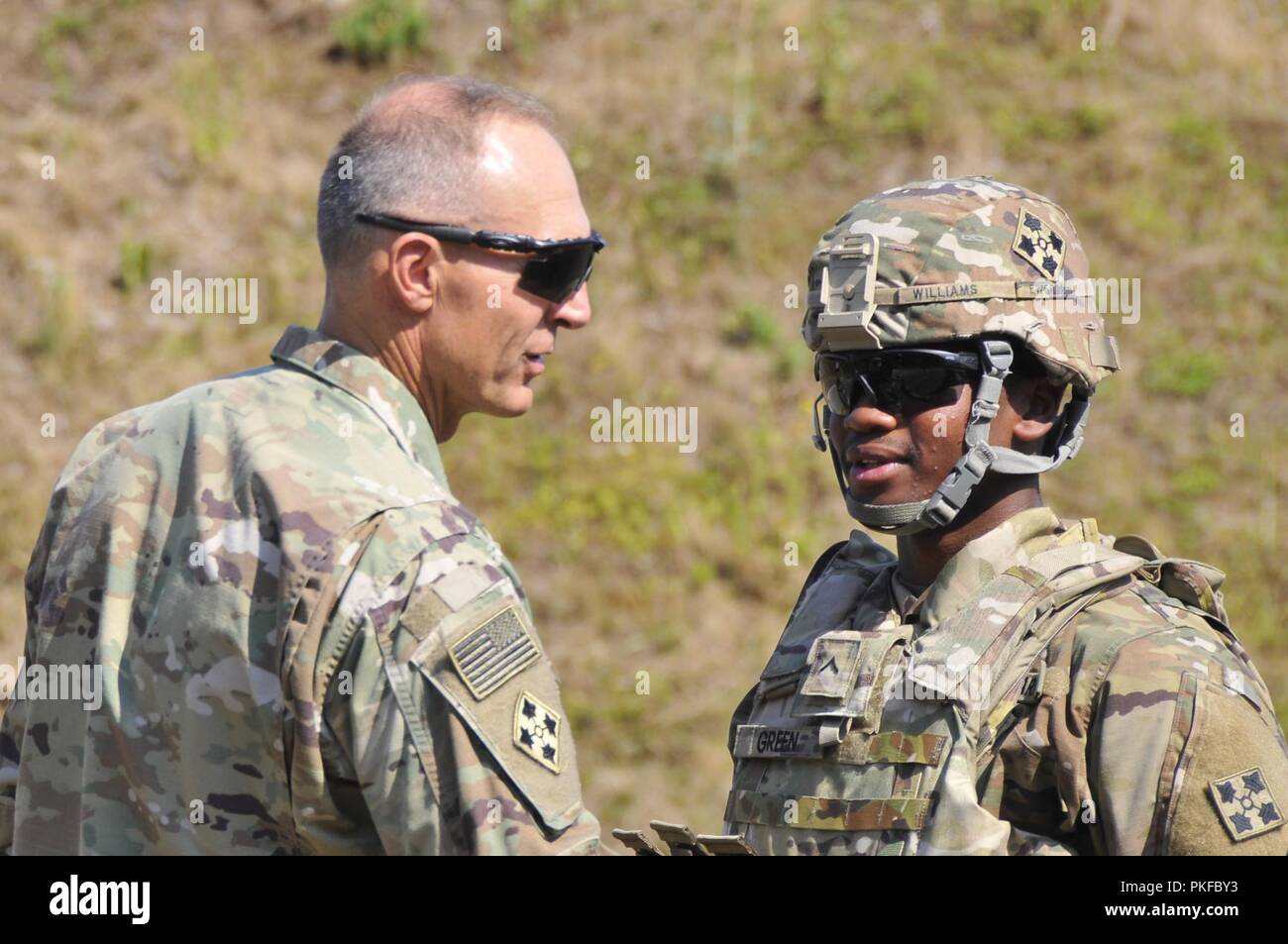 Maj. General Randy A. George conducts battlefield circulation at the Oberdachstetten Range Complex, Germany, Aug. 3, 2018. The 4th Infantry Division Commanding General visited with Soldiers of the 404th Aviation Support Battalion, 4th Combat Aviation Brigade, as they participate in Operation Atlantic Resolve. Atlantic Resolve is a demonstration of continued U.S. commitment to collective European security through a series of actions designed to reassure NATO allies and other European partners of America's dedication to enduring peace and stability throughout Europe. Stock Photo