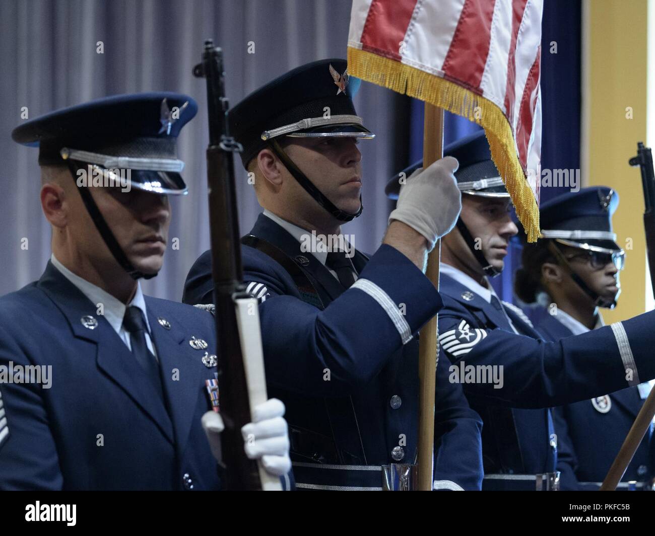Airmen of the Base Honor Guard present the colors during the promotion ceremony for Col. Eric Laughton, commander of the 107th Medical Group, 107th Attack Wing, New York National Guard, at Niagara Falls Air Reserve Station, N.Y., Aug. 11, 2018. The ceremony took place during drill weekend and is attended by Airmen, family and friends. Stock Photo