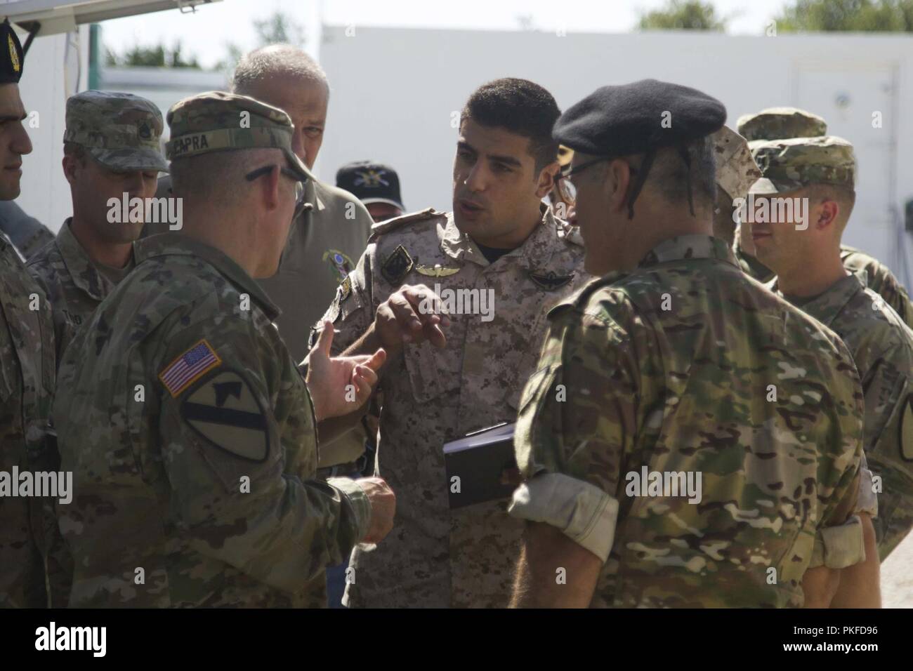 1st Lt. Ali Moualem, Air Assault Regiment, Lebanese Armed Forces,  discusses with Greywolf commander, Col. Kevin Capra of the importance of the training simulators, and what benefit they bring to the fight. Stock Photo