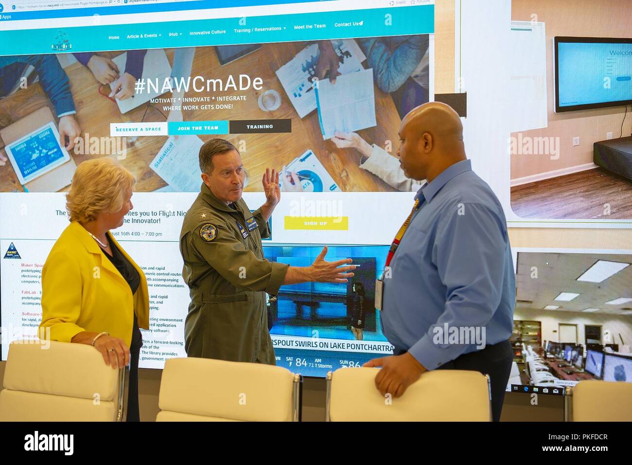 Naval Air Warfare Center Aircraft Division Commander, Rear Adm. Shane Gahagan, and Executive Director, Leslie Taylor, tour the command's new Innovation Hub during the open house event Aug. 7-9. Stock Photo