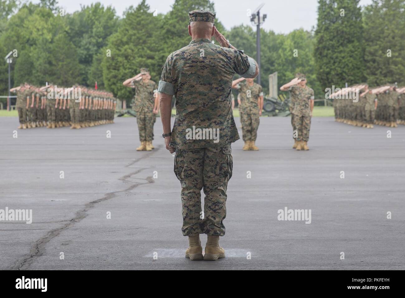 U.S. Marine Corps Gen. Robert B. Neller, commandant of the Marine Corps, salutes during an Officer Candidates School graduation and commissioning ceremony on Marine Corps Base Quantico, Va., Aug. 11, 2018. The candidates must go through three months of intensive training to evaluate and screen individuals for the leadership, moral, mental, and physical qualities required for commissioning as a U.S. Marine Corps officer. Stock Photo