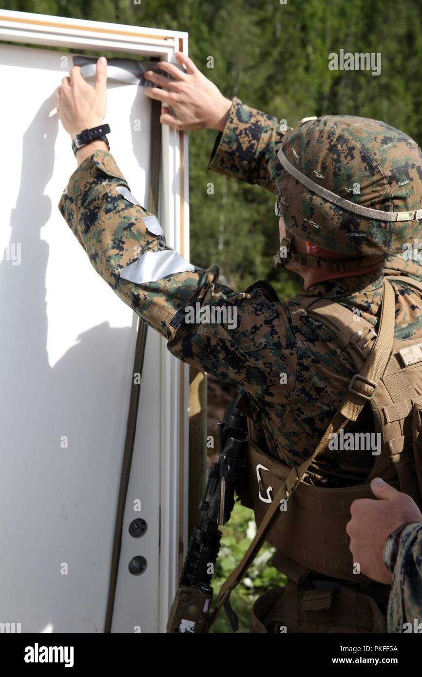 A U.S. Marine with Marine Rotational ForceEurope 18.1 attaches a