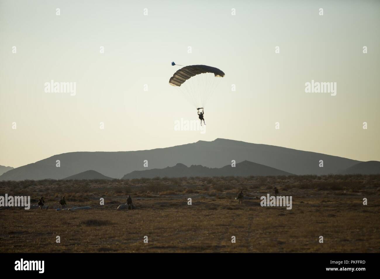 A Reconnaissance Marine glides through the air during parachute jumps, August 6, 2018, at a drop