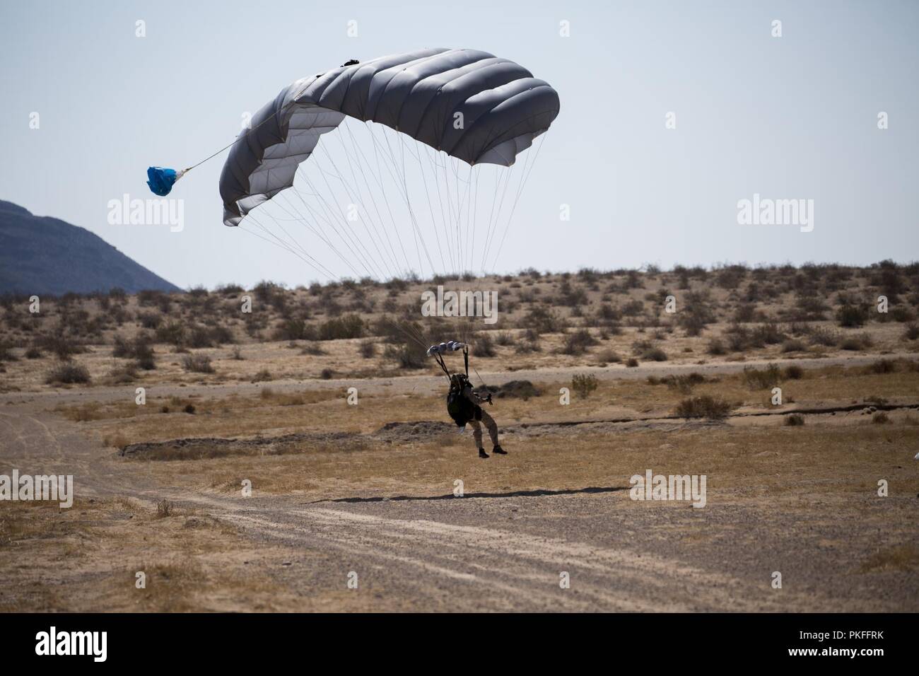 A Reconnaissance Marine prepares to land during parachute jumps, August 7, 2018, at a drop zone