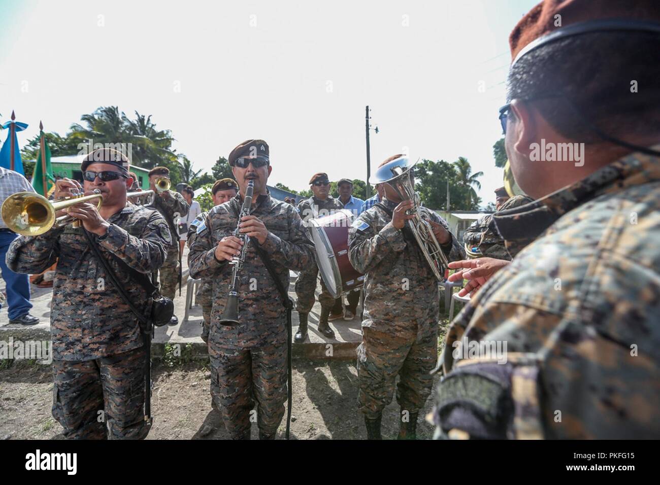 A Guatemalan Army band plays the U.S. national anthem before the ribbon cutting and transfer of keys at a construction site where Marines with Special Purpose Marine Air-Ground Task Force - Southern Command worked together with Guatemalan engineers in La Paz, Guatemala, Aug. 6, 2018 . The Marines and sailors of SPMAGTF-SC are conducting security cooperation training and engineering projects alongside partner nation military forces in Central and South America. The unit is also on standby to provide humanitarian assistance and disaster relief in the event of a hurricane or other emergency in th Stock Photo