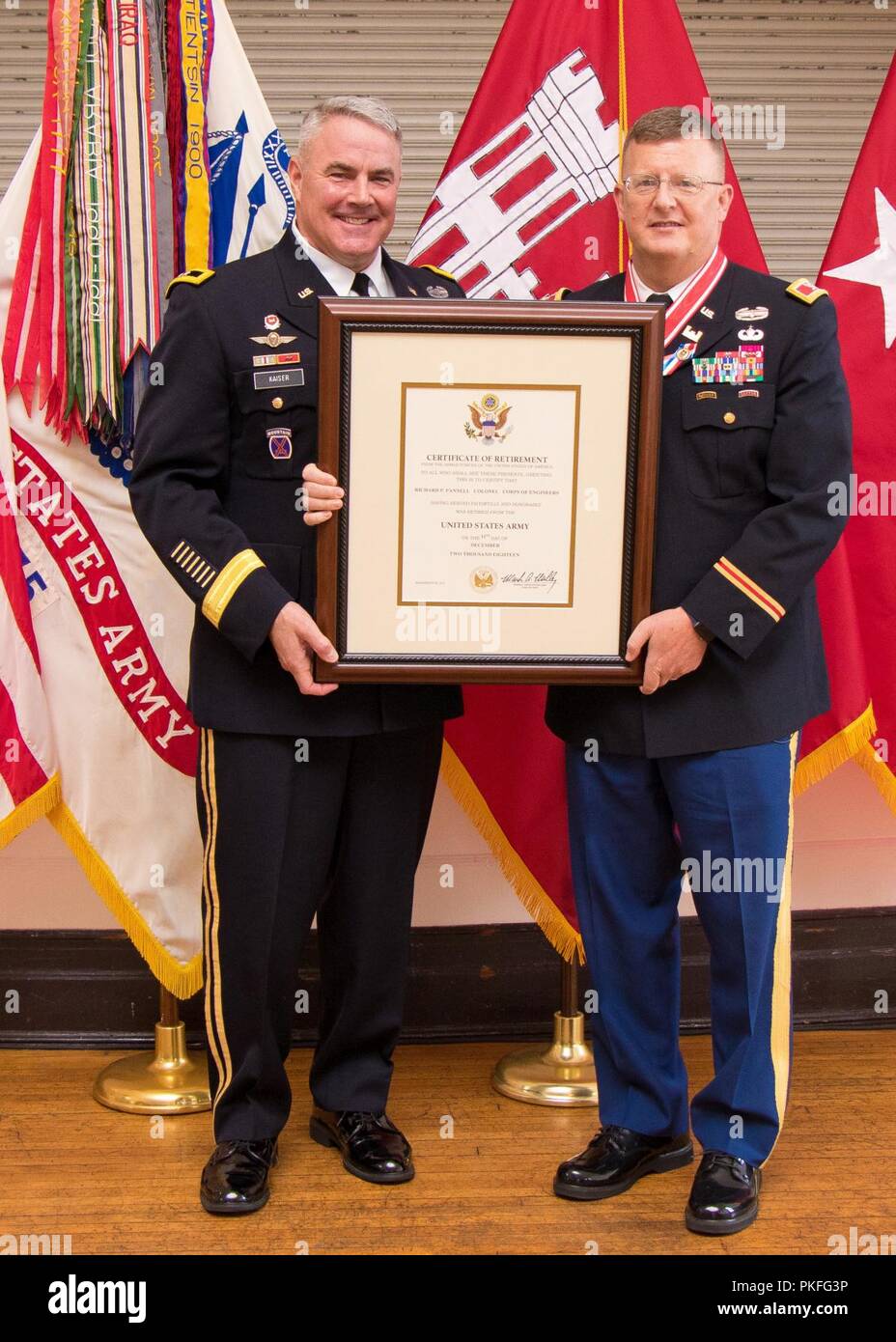 Maj. Gen. Richard Kaiser, commander of the U.S. Army Corps of Engineers - Mississippi Valley Division, presents a retirement certificate to Col. Richard Pannell, former USACE - MVD deputy commander, during Pannell's retirement ceremony at the B.B. Club in Vicksburg, Mississippi, Aug. 10, 2018.  Pannell retired with more than 30 years of dedicated military service. Stock Photo