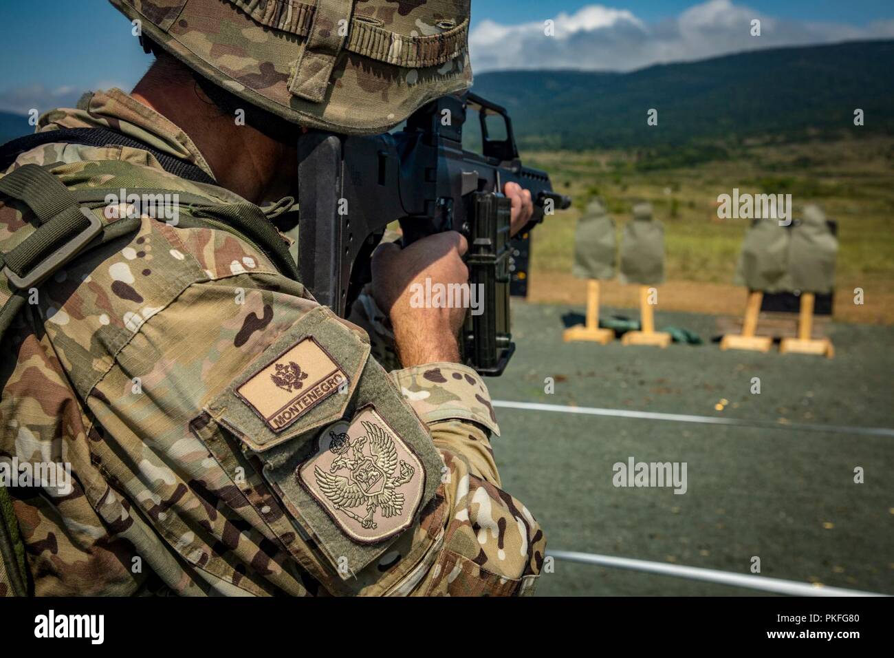 A member of the Montenegrin Armed Forces executes a Combat Marksmanship Program range during Exercise Platinum Lion 18 at Novo Selo Training Area, Bulgaria, Aug. 1, 2018. Platinum Lion is an annual field training exercise that reinforces relationships in a joint training environment, builds understanding of partner nation tactics, techniques and procedures, and increases interoperability with Allied and partner forces. Stock Photo