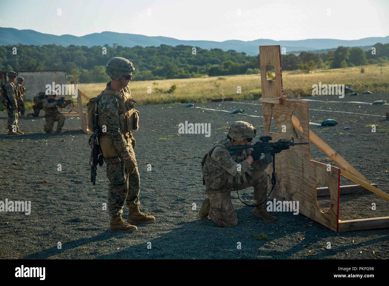 U.S. Marines with Black Sea Rotational Force 18.1 supervise U.S. Army soldiers executing an advanced portion of a Combat Marksmanship Program range during Exercise Platinum Lion 18 at Novo Selo Training Area, Bulgaria, Aug. 5, 2018. Platinum Lion is an annual field training exercise that reinforces relationships in a joint training environment, builds understanding of partner nation tactics, techniques and procedures, and increases interoperability with Allied and partner forces. Stock Photo